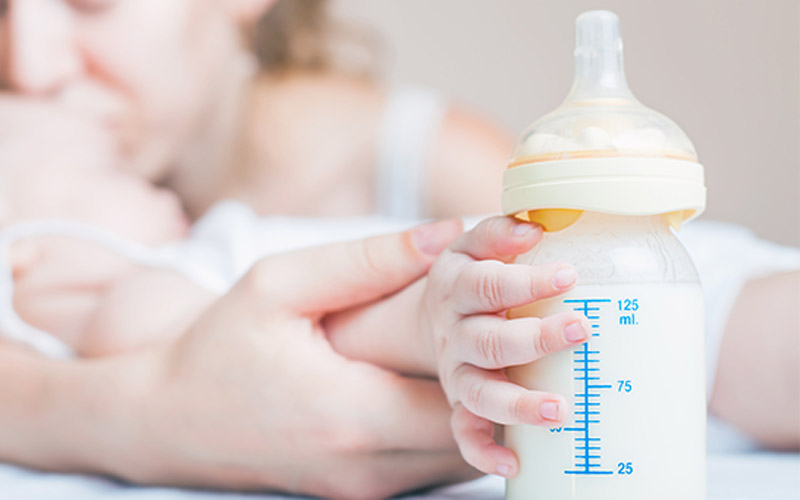 What are the tips and precautions for bottle feeding